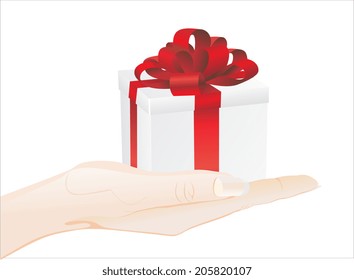 Woman's hand holding object - gift