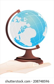 Woman's hand holding object- Globe