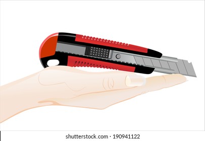 Woman's hand holding object- office knife isolated on white background.