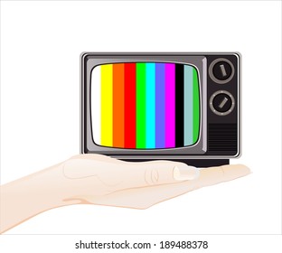 Woman's hand holding object-classic tv -colorful no signal 