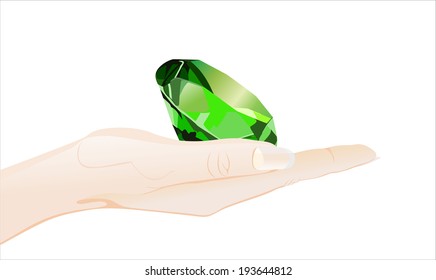 Woman's hand holding object-emerald isolated on white background. 