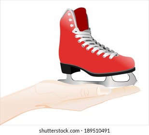 Woman's hand holding object-figure skates