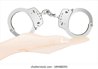 Woman's hand holding object-Handcuffs 
