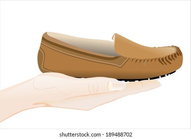 Woman's hand holding object-moccasin slipper