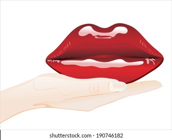 Woman's hand holding object-red lips isolated on white background. 