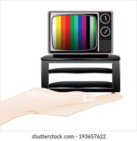 Woman's hand holding object-retro and classic television  isolated on white background.