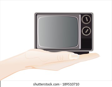 Woman's hand holding object-retro tv