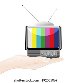 Woman's hand holding object-retro tv isolated on white background.
