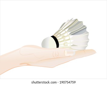 Woman's hand holding object-shuttlecock isolated on white background.