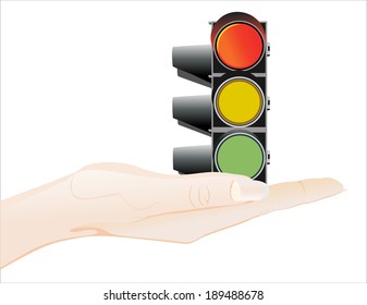 Woman's hand holding object-Traffic lights