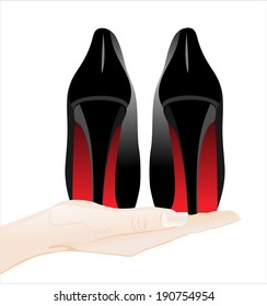 Woman's hand holding object-woman shoes isolated on white background.