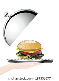 Woman's hand holding silver platter with big hamburger   on white background isolated
