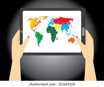 woman's hand holding a tablet with world map on the screen