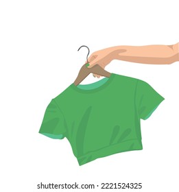 Woman's hand holding T-short on a hanger. Vector illustration.