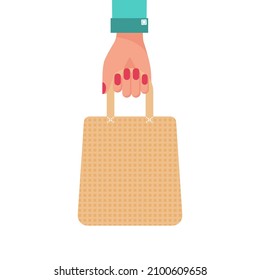 The woman's hand holds the ecological bag. Reusable tissue bag. Vector illustration flat design. Isolated on white background. Ecobag fabric, cloth cotton.