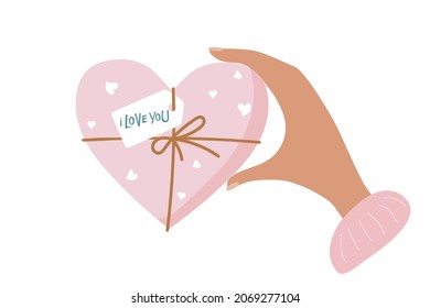Woman's hand holds pink heart-shaped box with I love you tag. Flat vector isolated. Valentine's Day, Mother's day, Birthday gift box. Holiday celebration,romantic date or anniversary.