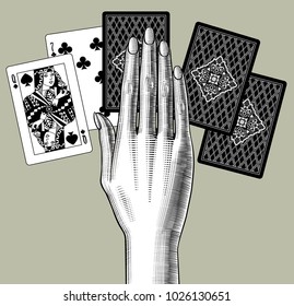 Woman's hand laying out playing cards fan. Vintage engraving stylized drawing. Vector illustration 