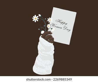 Woman's hand with an object. Decoration on the hand. Girl with flowers and beautiful jewelry. Girl with a letter. women's Day.