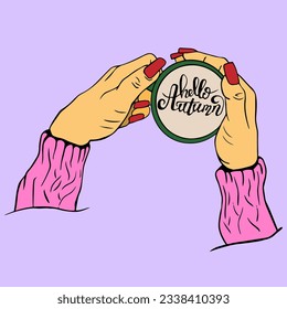 woman's hand in pink knitted sweater holds cup, mug with hot drink for warming with the inscription Hello, autumn. concept of an autumn morning. Cozy autumn mood. View from above.