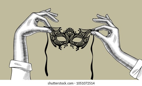 Woman's hands with a decorative carnival Venetian mask. Vintage stylized drawing. Vector illustration
