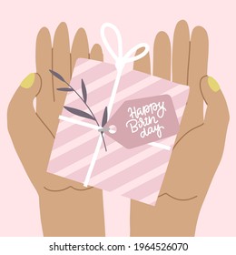 Woman's hands holding present box isolated on pink. Gift in paper with ribbon and brance. Top view. Flat vector illustration