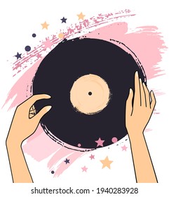 Woman's hands with a vinyl record. Retro music concept