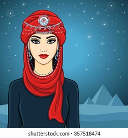 The woman's portrait in a turban. Background desert and pyramids.
