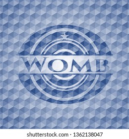 Womb blue emblem with geometric background.