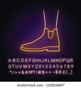Women ankle boots neon light icon. Chelsea trendy shoes side view. Female flat heel footwear design for fall. Glowing sign with alphabet, numbers and symbols. Vector isolated illustration