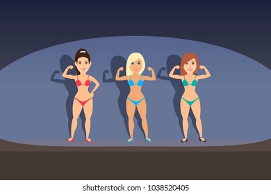 women bodybuilders posing on stage