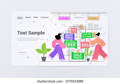 women choosing discount coupons on smartphone screen in mobile app online shopping concept supermarket interior