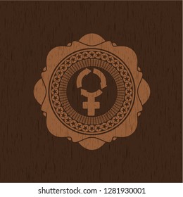 women cycle icon inside badge with wood background