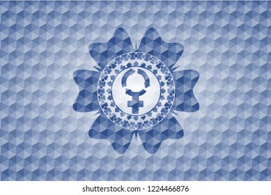 women cycle icon inside blue badge with geometric pattern.