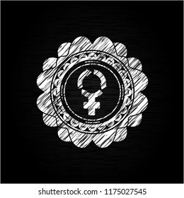 women cycle icon inside chalkboard emblem on black board