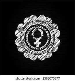 women cycle icon inside chalkboard emblem on black board