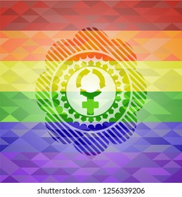 women cycle icon inside emblem on mosaic background with the colors of the LGBT flag