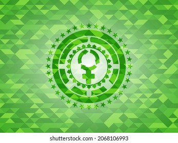 women cycle icon inside green emblem with triangle mosaic background. 