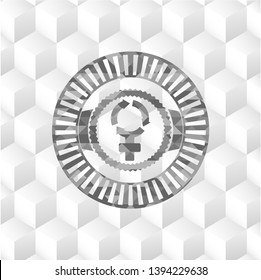 women cycle icon inside grey emblem with geometric cube white background