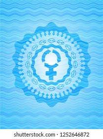 women cycle icon inside light blue water wave style badge.
