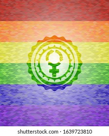 women cycle icon on mosaic background with the colors of the LGBT flag