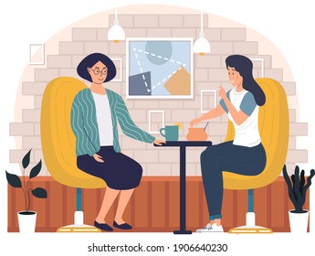 Women drinking tea. Girls spend time outdoors. Female friends are sitting in cafe, communicating and taking hot drinks. Girlfriends gossip together in restaurant. People sit with lemon tea on table