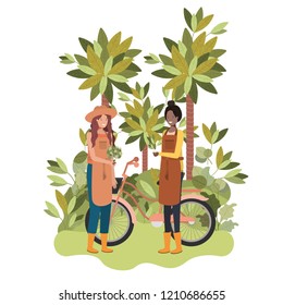 women gardeners with bicycle in landscape