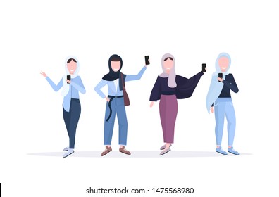 Women in headscarf taking selfie photo with smartphone camera. Arab female cartoon characters standing together photographing.