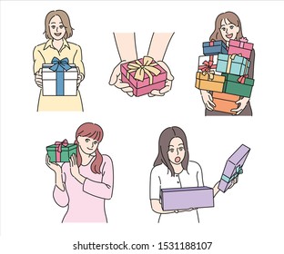 Women are holding gift boxes tied with ribbons. hand drawn style vector design illustrations. 