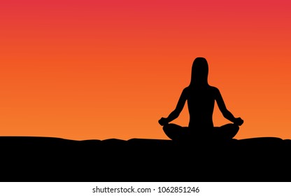 women meditating on high mountain in sunset background