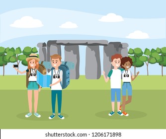 women and men friends with backpack in the stonehenge