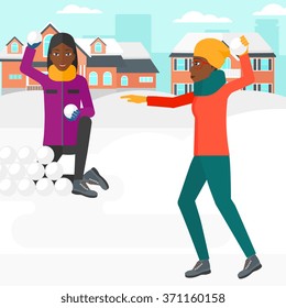 Women playing in snowballs.