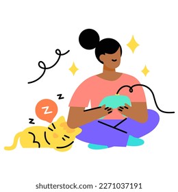 Women playing video games while her cat is sleeping
