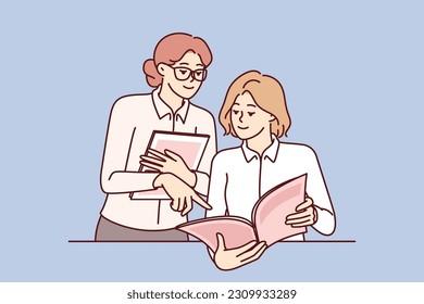 Women read magazine and discuss fashion trends or article by journalist with city news. Girl employee of store or cafe demonstrates to visitor magazine-catalog of products or restaurant menu