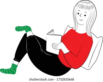 Women in red sweater reading on the bed while leaning on a white pillow